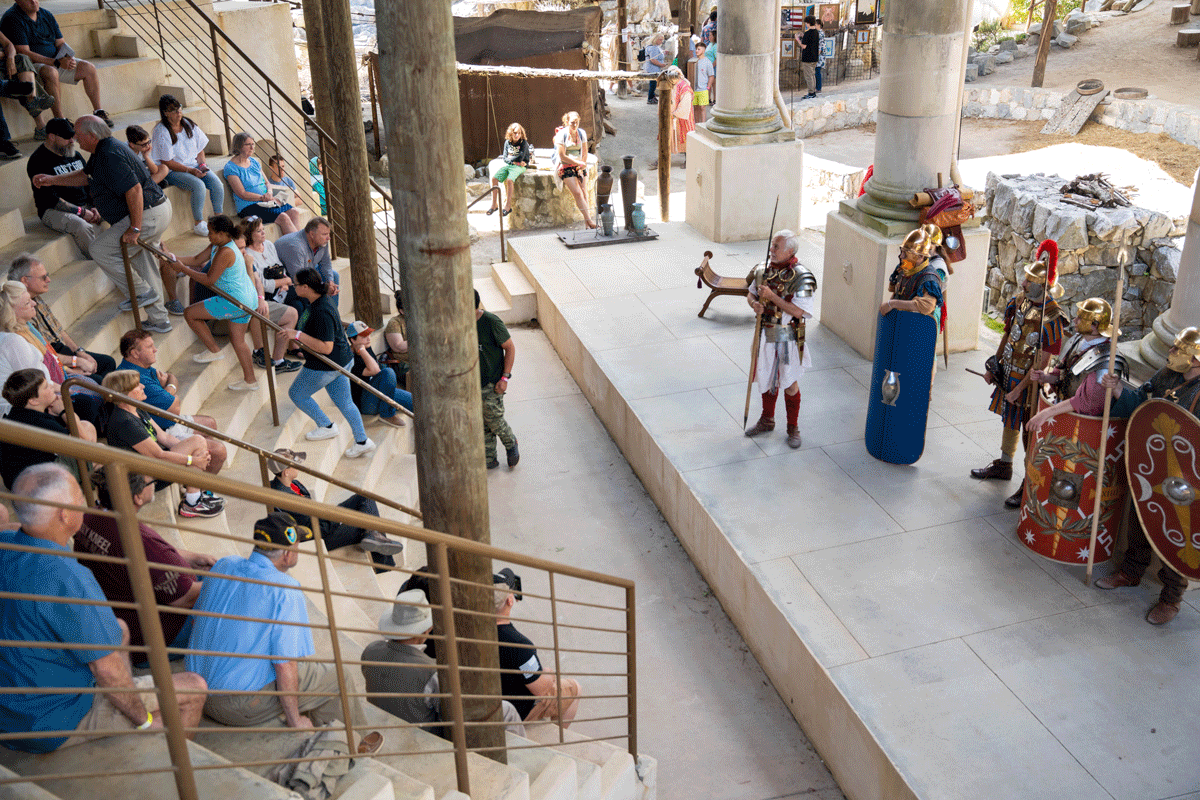 A crowd watching a costumed performance of soldiers at the Biblical History Center in LaGrange, Georgia.