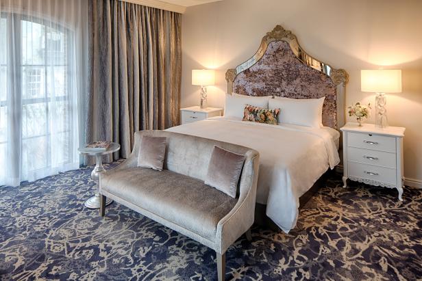 A plushly furnished room in the Three Muses building of the JW Marriott Savannah Plant Riverside District