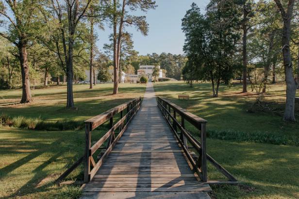 A walkway leads to a historical mound and park