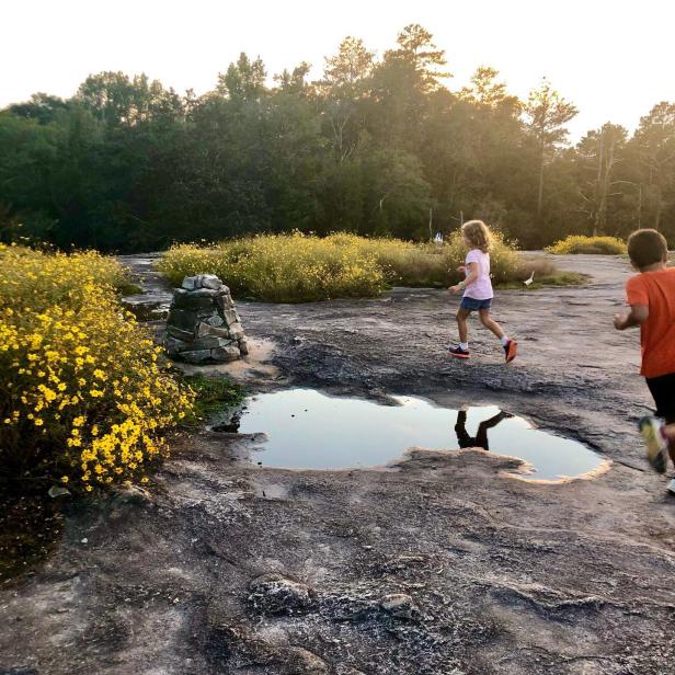 Children playing on Arabia Mountain in Stonecrest, Georgia, a free thing to do near Atlanta. Photo by @allisonlgoodman