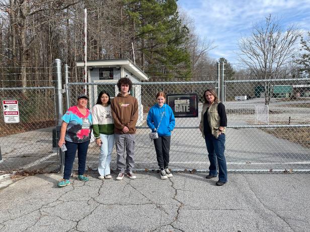 Visitors at the Grimes Gate on the Dead in a Day Tour