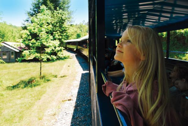 Young girl riding the Blue Ridge Scenic Railway in Blue Ridge, Georgia