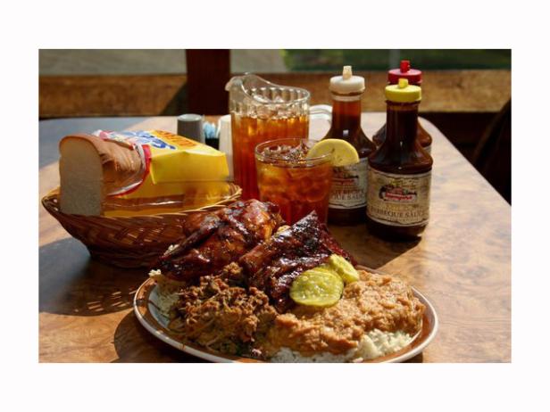 Barbecue and side dishes sitting on a table