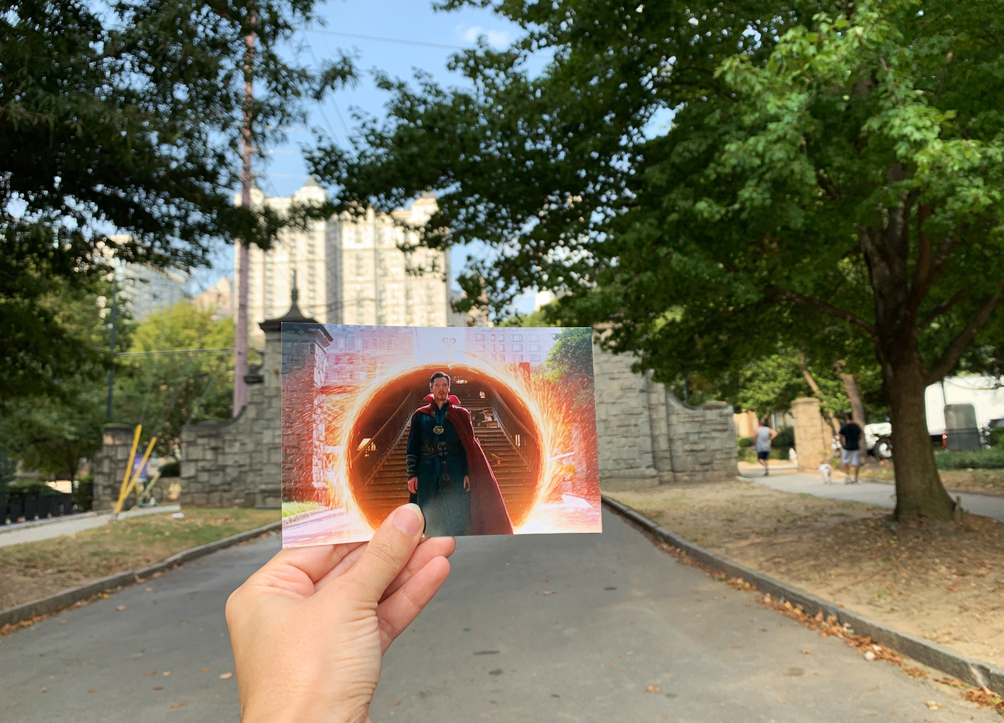 Hand holding photo of a scene from Avengers: Infinity War in Atlanta's Piedmont Park