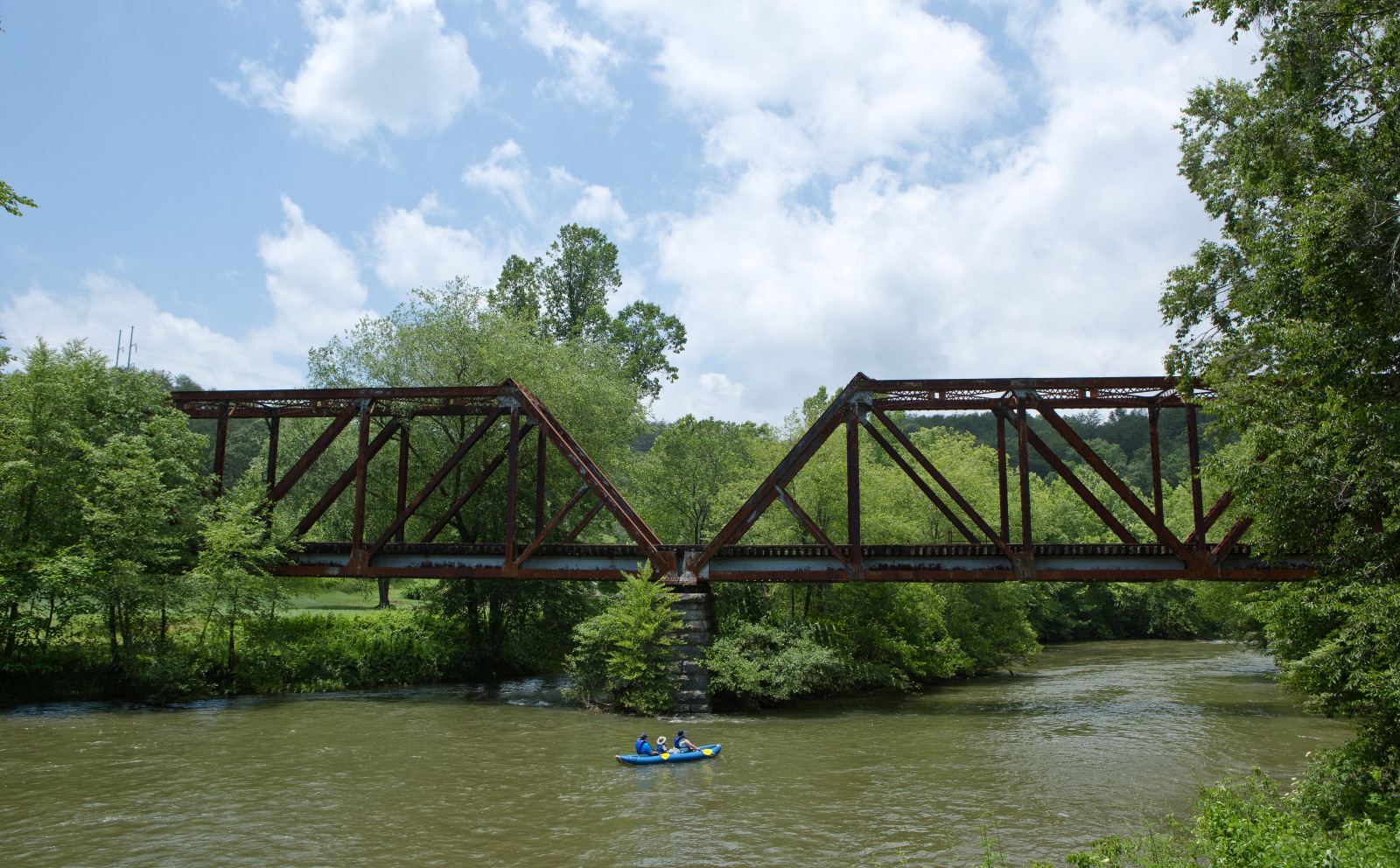 Kayaking under a bridge on the Toccoa River in Blue Ridge, Georgia