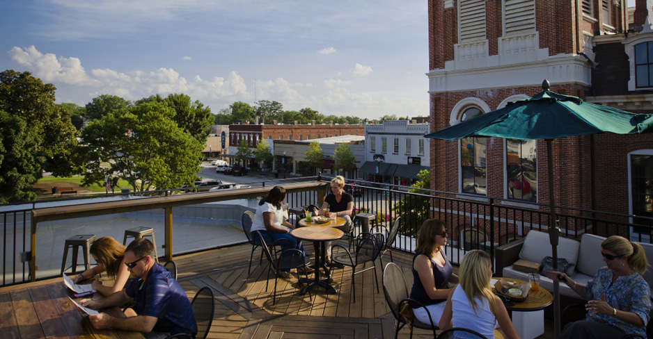 Keep an eye out for vampires in Covington's historic downtown square while enjoying modern Southern favorites on Mystic Grill's rooftop deck. - GDEcD Photography