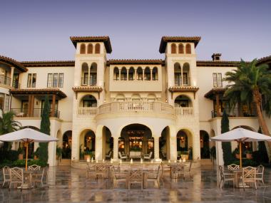The Cloister at Sea Island The entrance of a large luxury resort with ivory stonework.