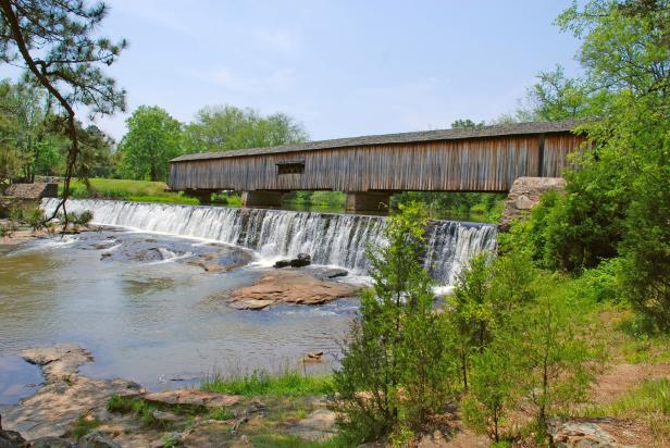 Covered bridge and waterfalls at Watson Mill Bridge State Park in Comer, Georgia