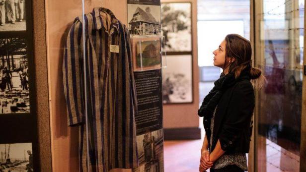 Woman standing in an exhibit at The Breman Museum in Atlanta, Georgia
