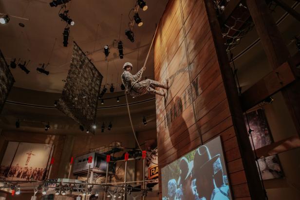 Exhibit showing a rappelling soldier