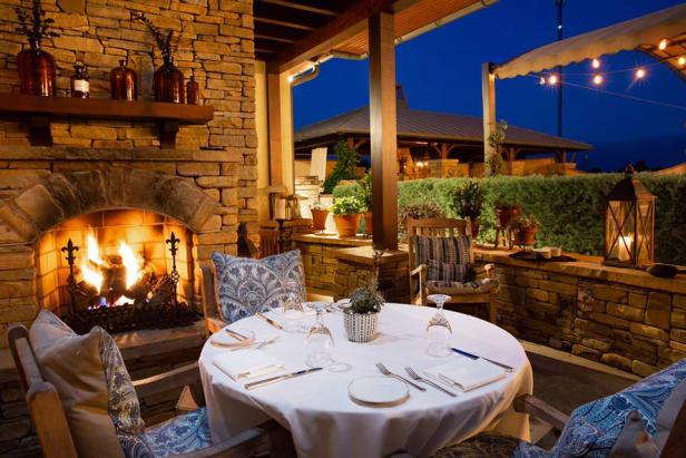 outdoor dining near a fireplace at Natalia's in Macon, Georgia