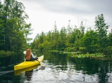 Woman kayaking in the Okefenokee Swamp. Photo by @wandernorthga